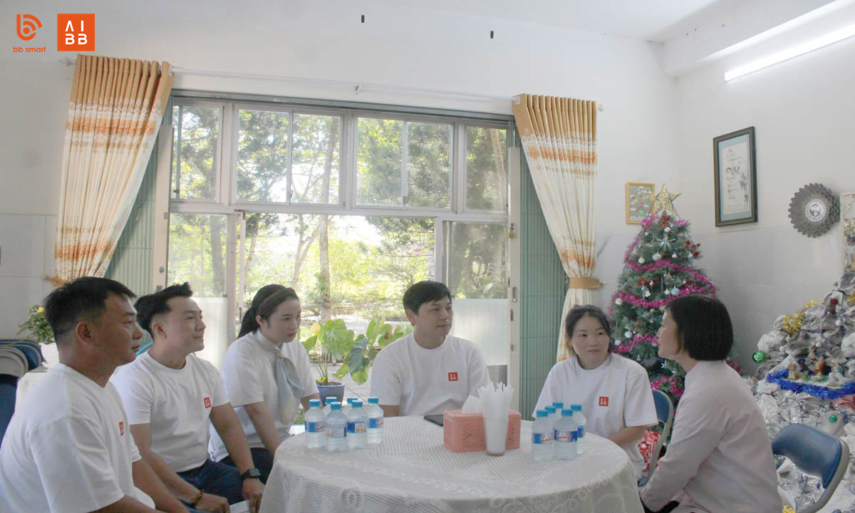 Representative of BBSMART Company shares encouragement for the ladies at Thien Phuoc disability facility